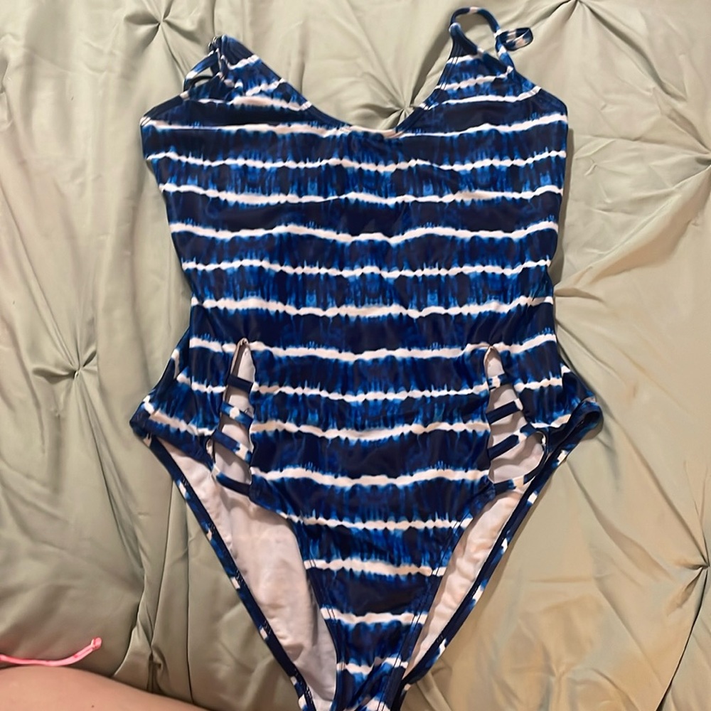 Swimsuit the tag says medium. It fits kind of like a girls extra large.